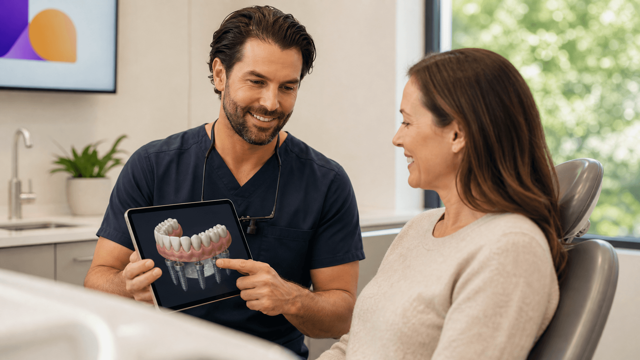 Dentist showing a patient a full-arch All-on-4 dental implant model on a tablet in a modern consultation room